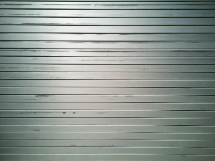 Close-up of slim aluminium sliding door frame profile showing narrow sightlines