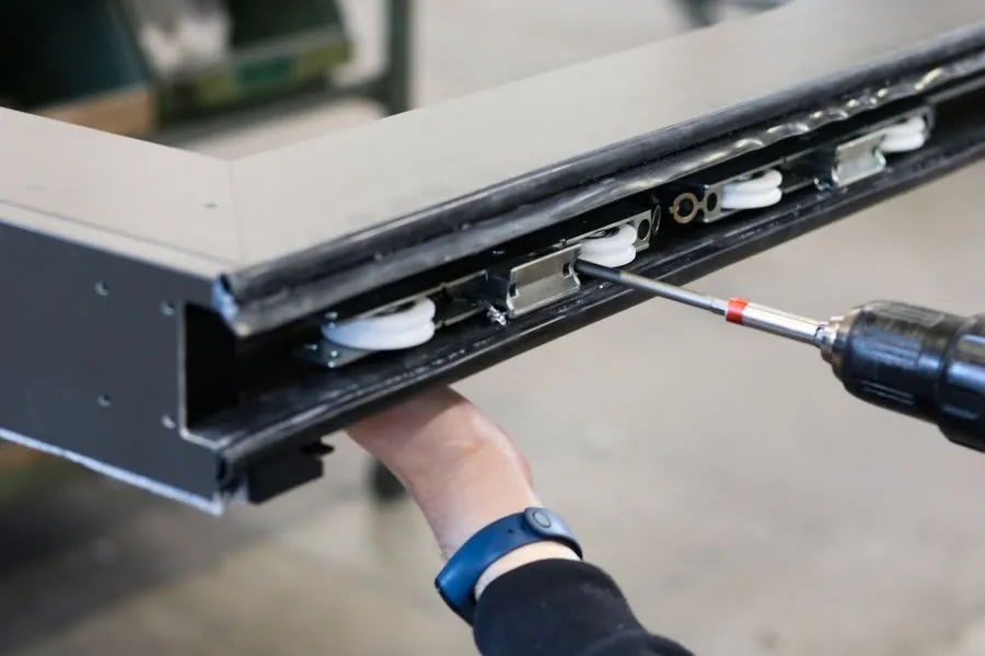 Aluminium sliding door track and roller hardware mechanism detail