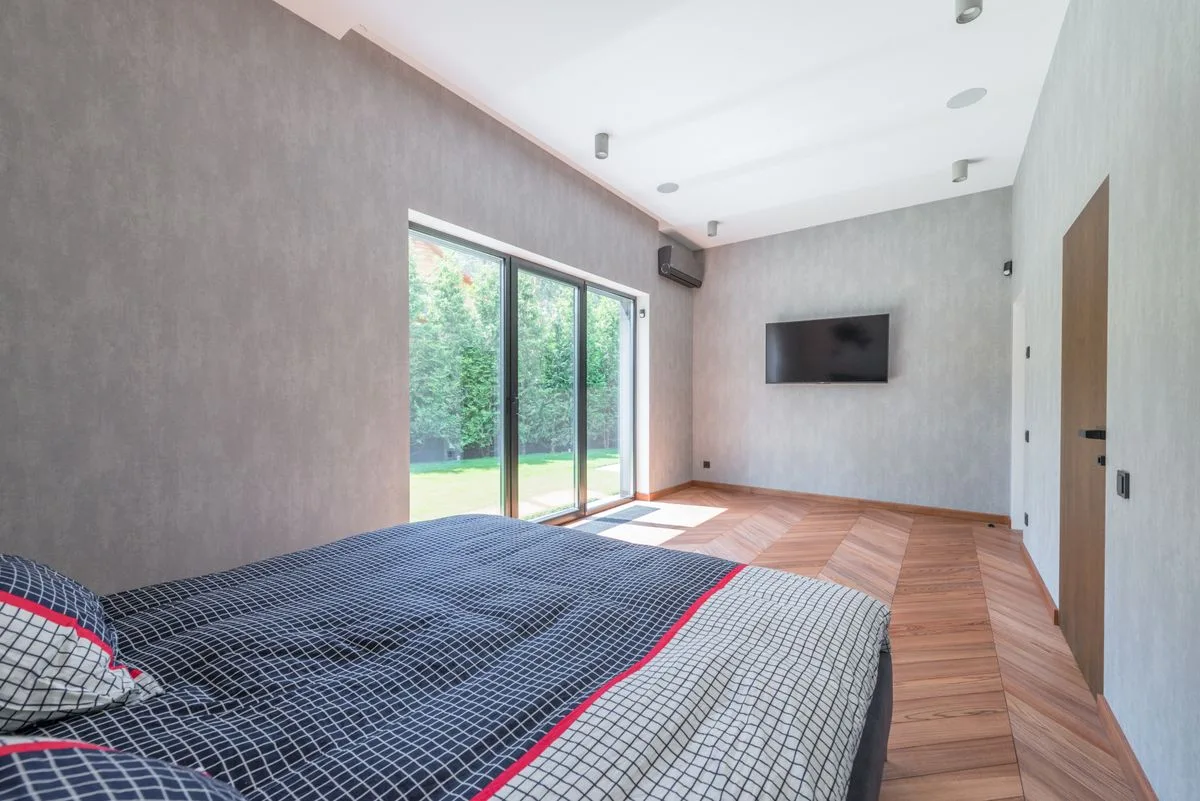 Aluminium bi-fold glass doors in bedroom - aluminium bi-fold installation in Exeter