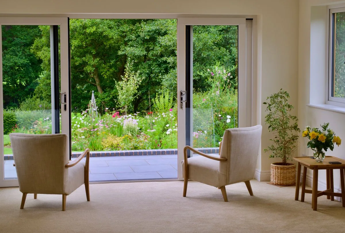 Sliding bi-fold glass doors in an Exeter home interior