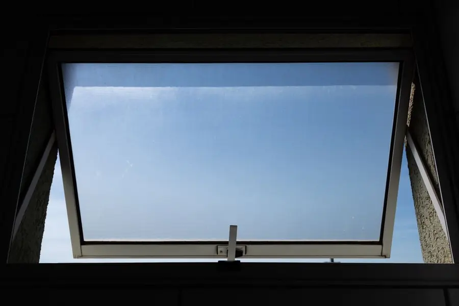 An open window letting fresh air circulate - background ventilation is the cheapest fix for condensation