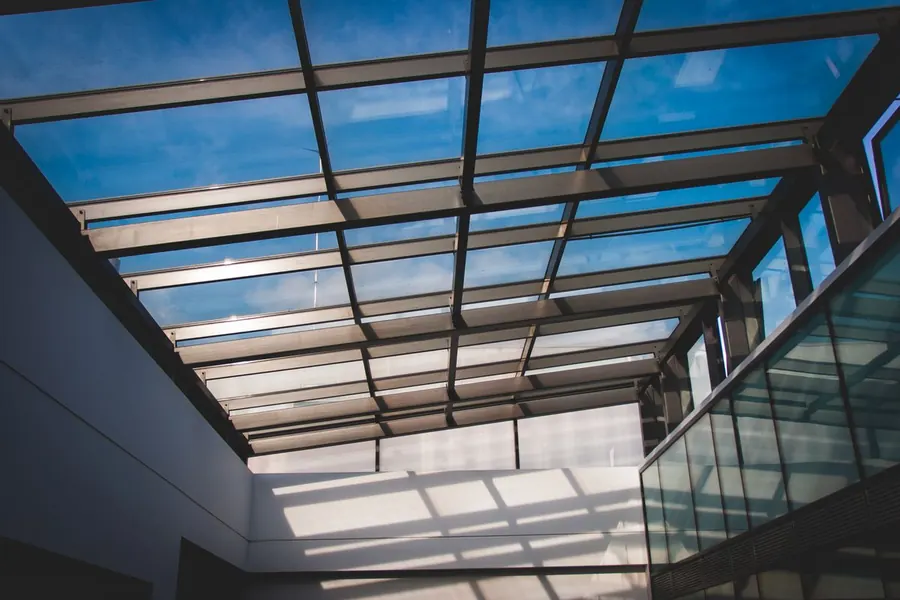 Glazed conservatory roof seen from below against daylight