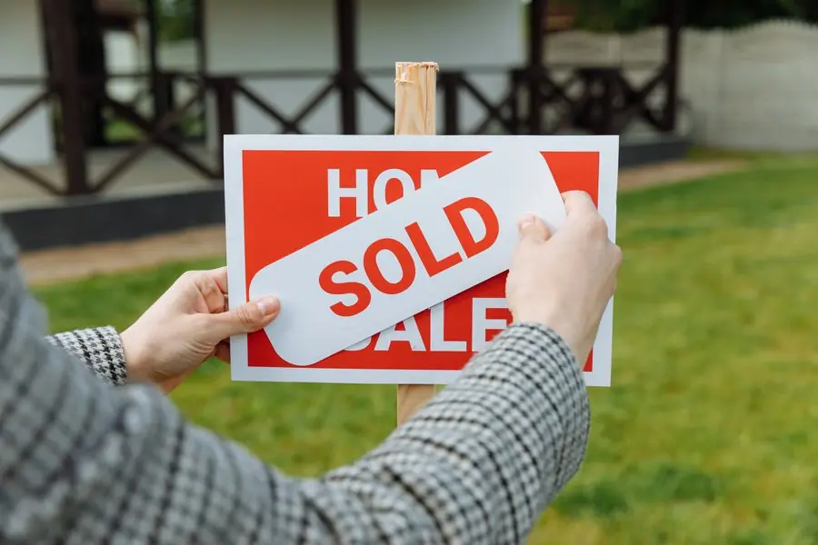 House sold sign outside a property - does double glazing add value when selling in Exeter