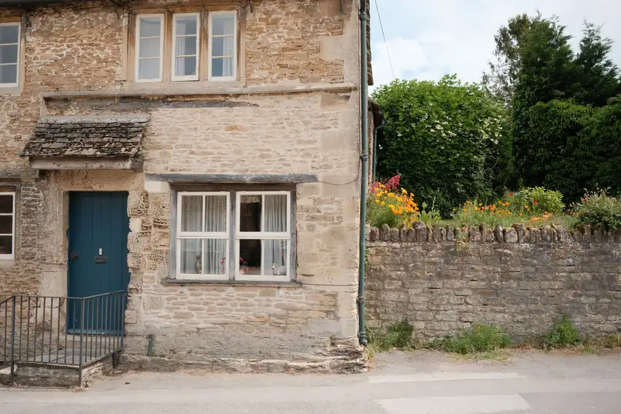 Timber lintel over a window in a rubble stone solid wall, the detail that governs window replacement near Exeter