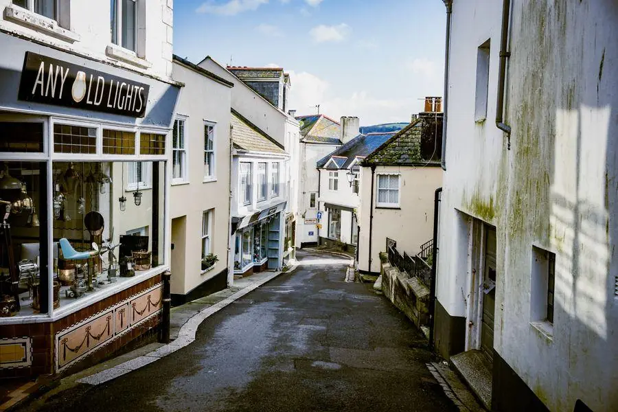 Narrow street of painted shops and houses with no room for parking, like the access a fitting crew finds on Fore Street in Topsham