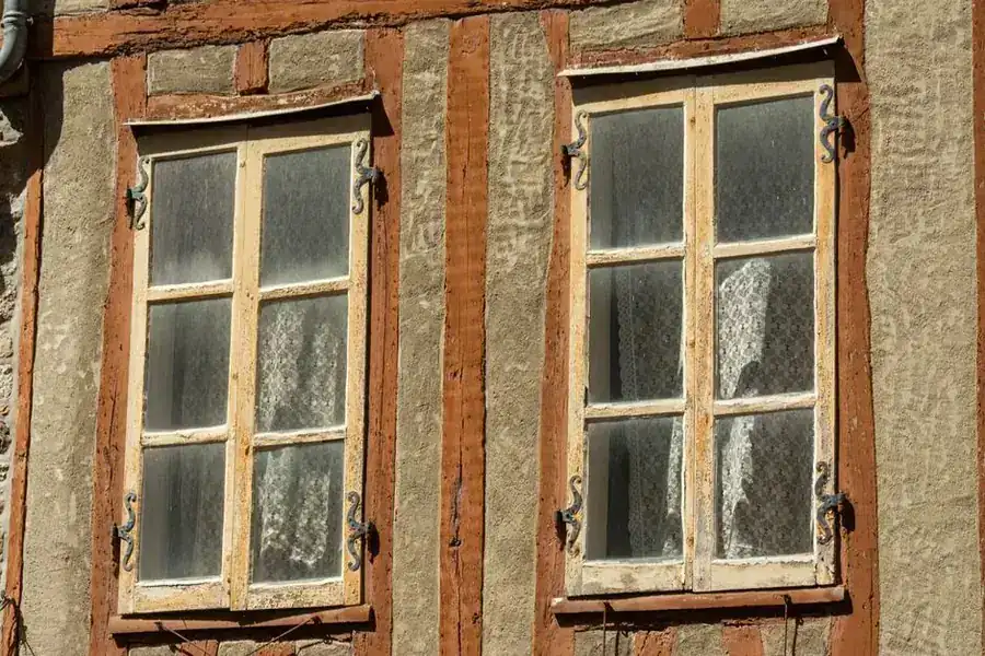 Timber wooden window frame on a house exterior - uPVC vs timber window frames for Exeter properties