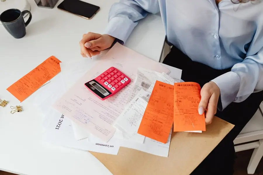 Energy bills and paperwork with a calculator - misleading funding claims cost households real money