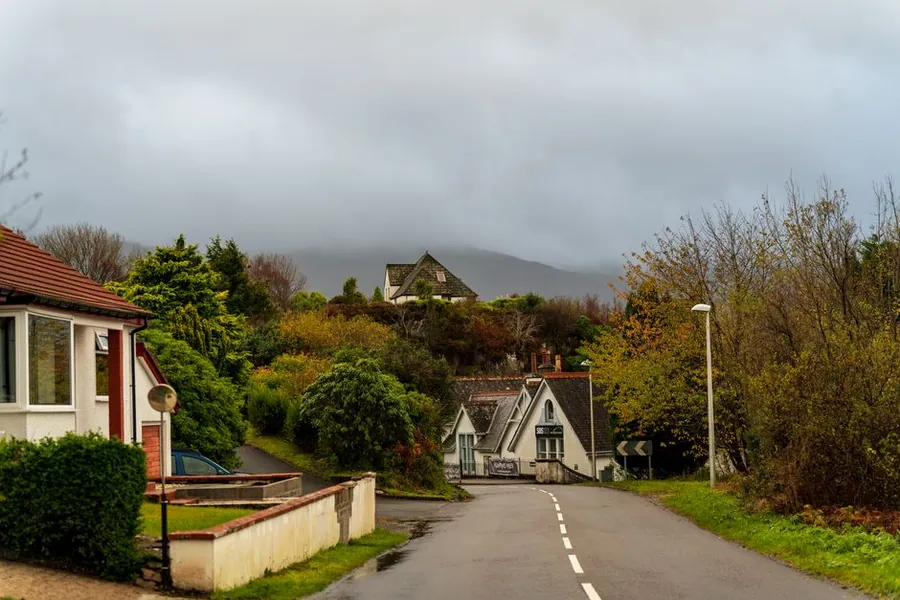 Autumn lane with houses in Devon, the quieter season for window replacement work