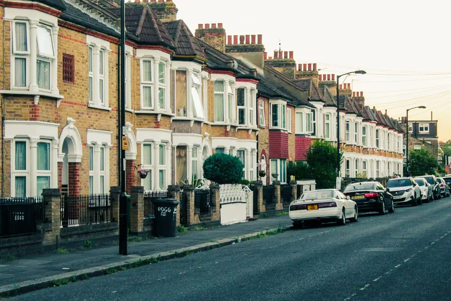 Terraced street in Exeter where windows are commonly replaced in phases