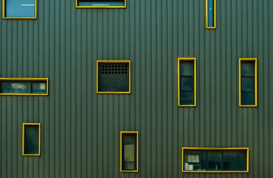 Range of coloured window frames on modern home exterior showing colour options