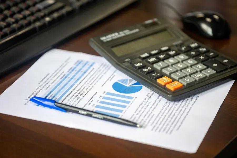 Written double glazing quote and paperwork on a desk in an Exeter home