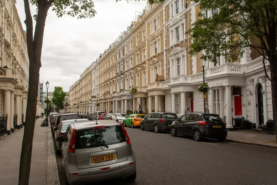 Victorian terrace of converted flats with traditional sash windows in a conservation area
