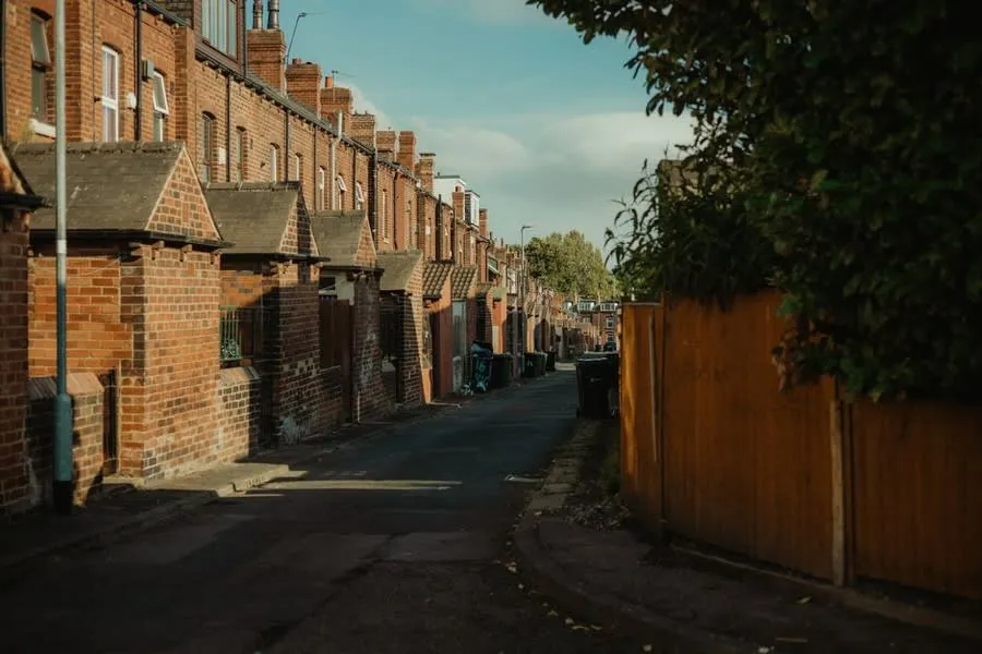 Row of brick terraced rental houses of the kind common across Exeter