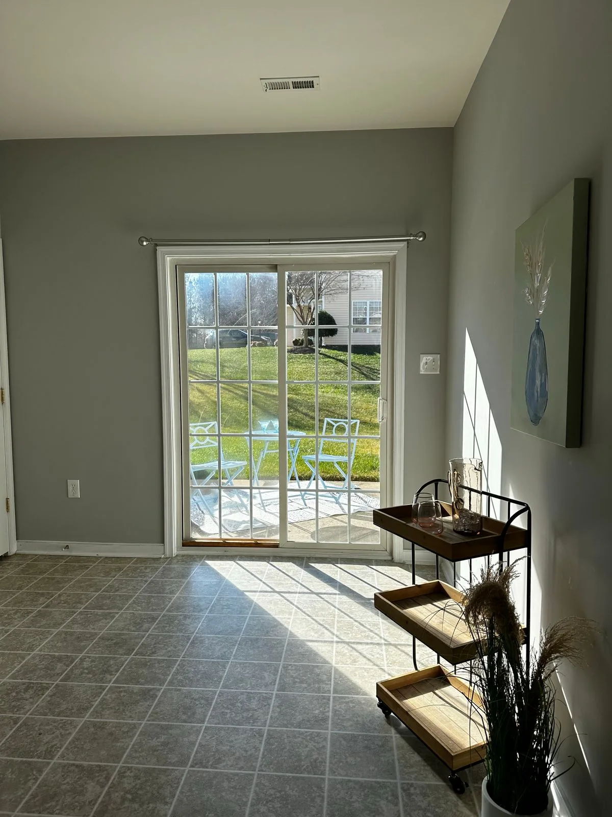 Living room with glass patio doors opening to garden in Exeter