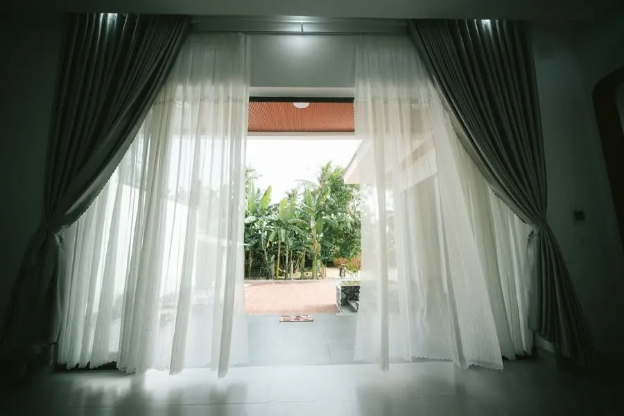 French doors opening onto a garden terrace from a residential property