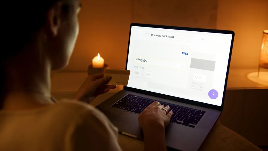 Homeowner entering credit card details to pay a window installation deposit in Exeter