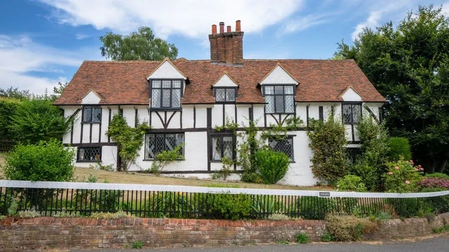 Traditional timber windows on an older cottage-style property near Exeter