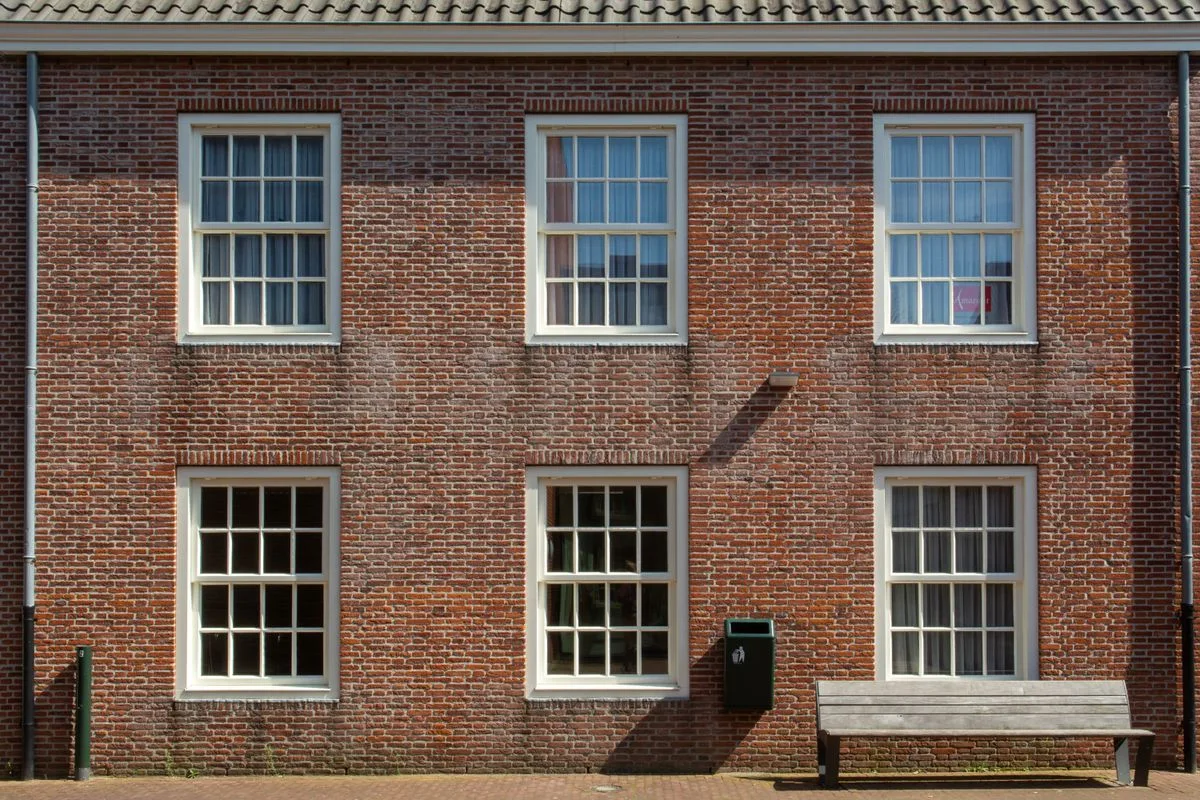 Sash windows in a brick building with acoustic glazing in Exeter