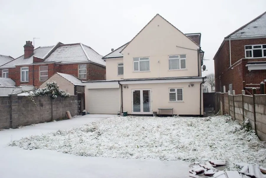 Rendered post-war house near Exeter with white uPVC replacement windows